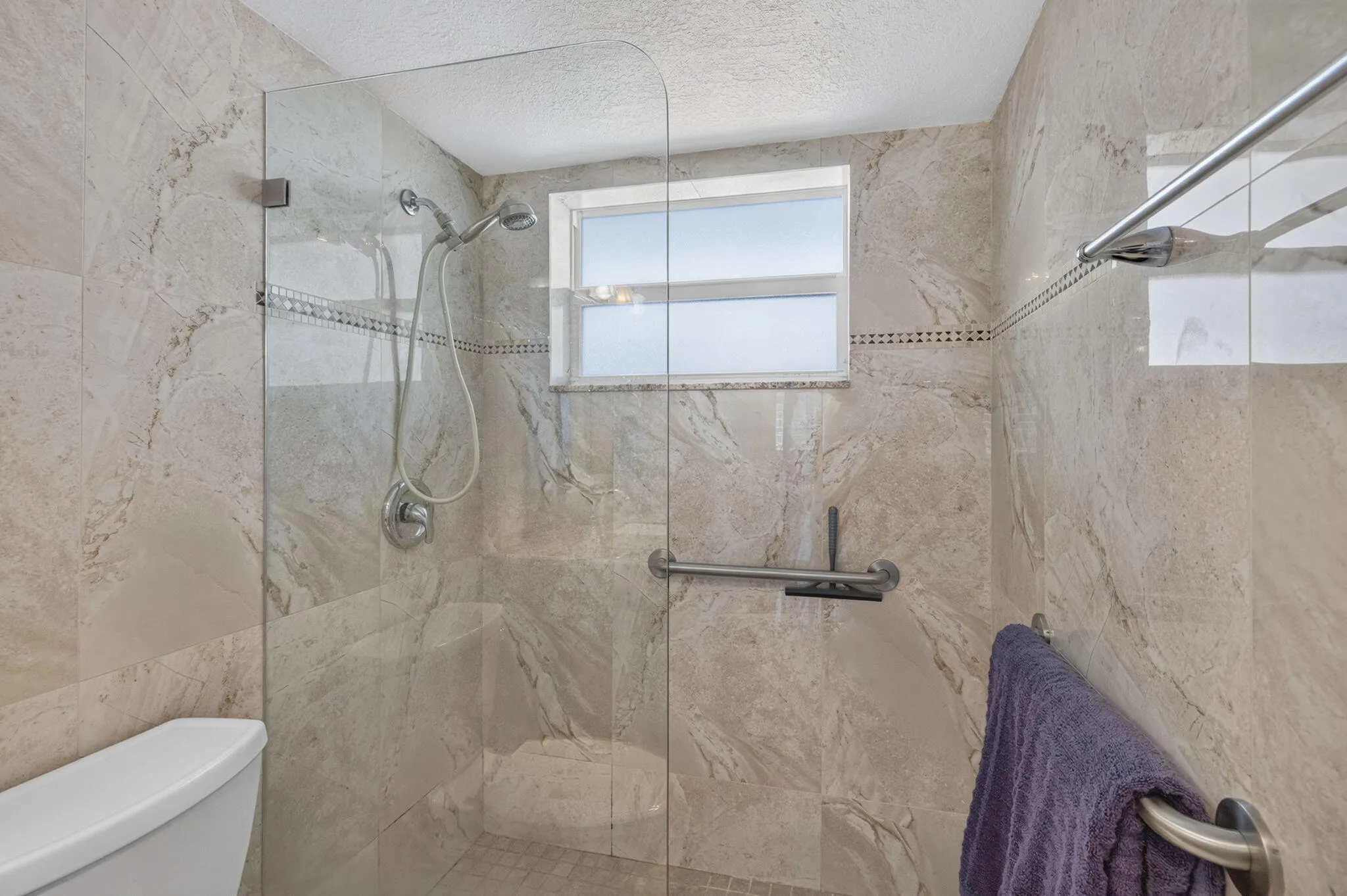 SHOWER IN THE BATHROOM