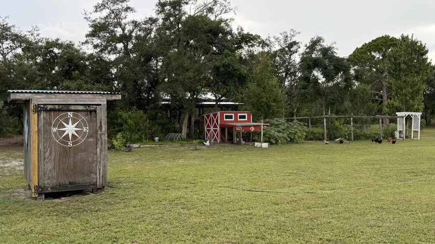 Escape to your own private slice of Florida paradise! Nestled on 2.95 fully fenced acres, this beautifully remodeled and fully furnished 2-bedroom, 2-bath home offers the perfect blend of modern comfort and peaceful country living. Enjoy a gorgeous she shed, pole barn, private pond with dock, walking trails, chicken coops, and nearly three acres of privacy, all on a paved road.