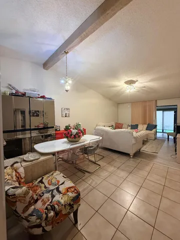 Vaulted ceiling with an exposed wood beam
