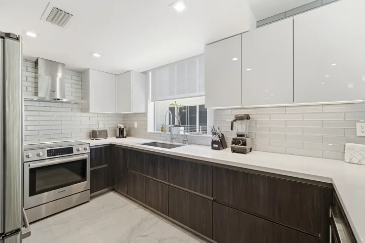 Upgraded Kitchen Cabinet Color, Upgraded Cabinet Organization, Upgraded Glass Backsplash, Upgraded Bosch Appliances