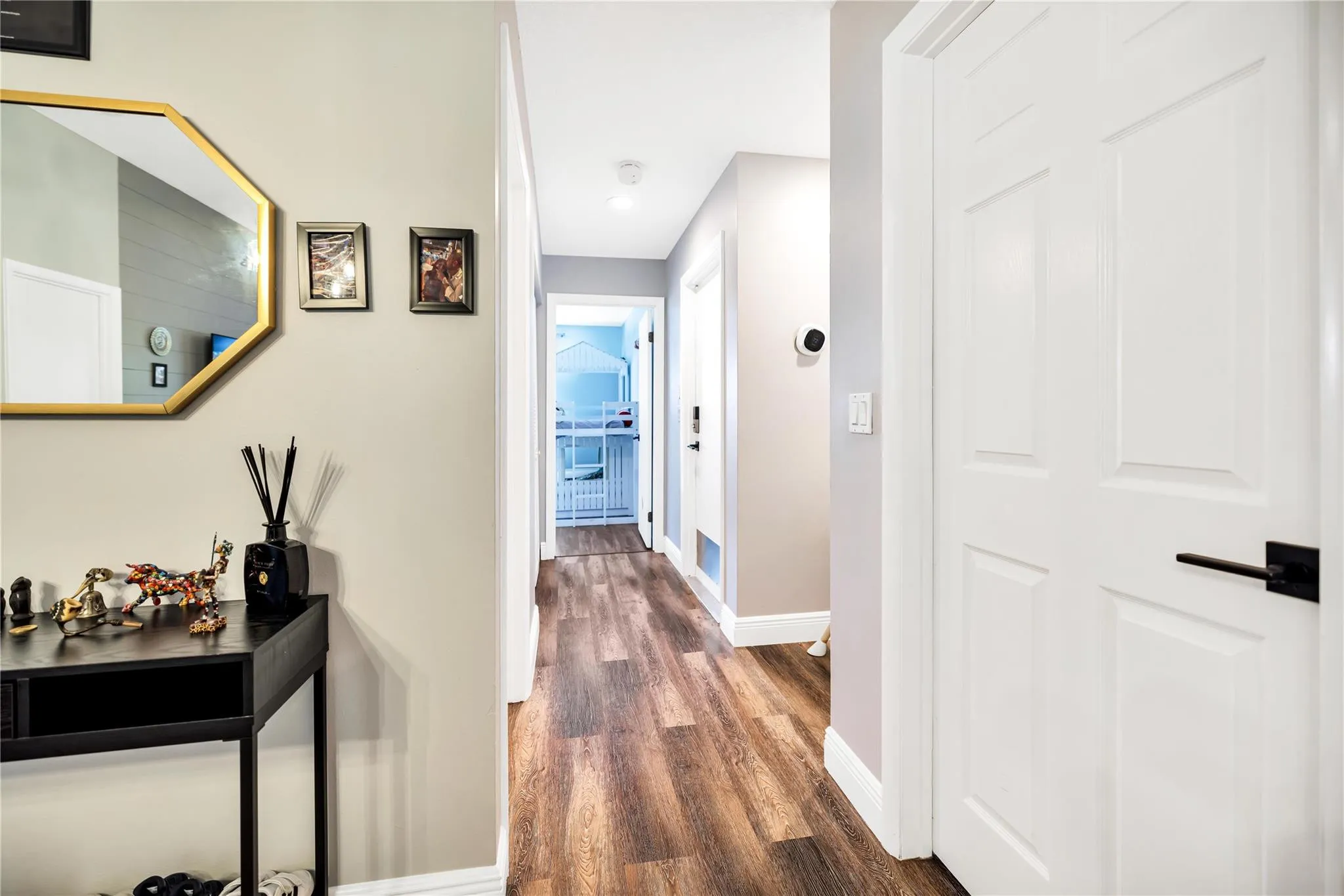 Hallway, Bedroom door on Right, as well as straight ahead.