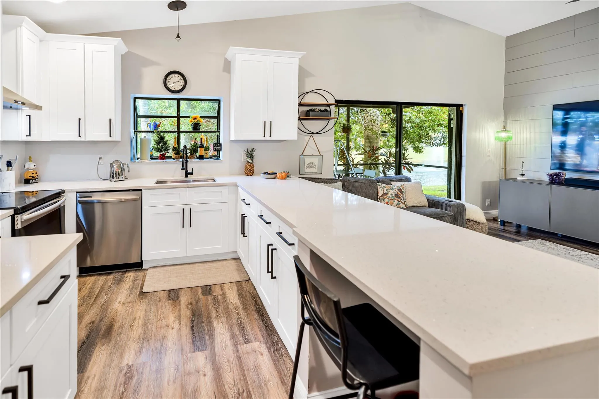 Beautiful white cabinets, Dishwasher to make life easy, and a Kitchen window nook w shelves allows for natual light and space to grow your own herbs!