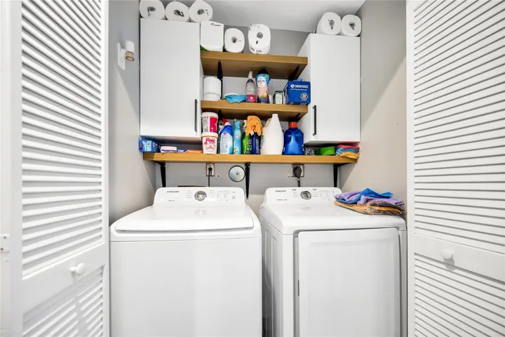 Laundry Closet with shelving and storage.
