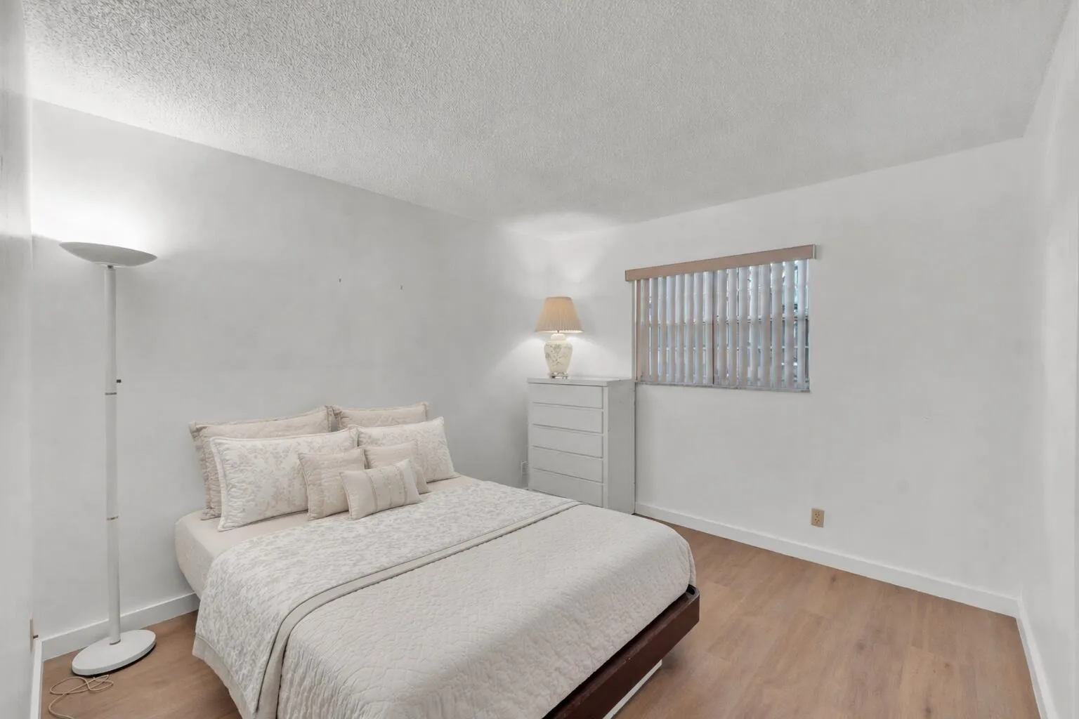 Guest bedroom featuring luxury vinyl floors.