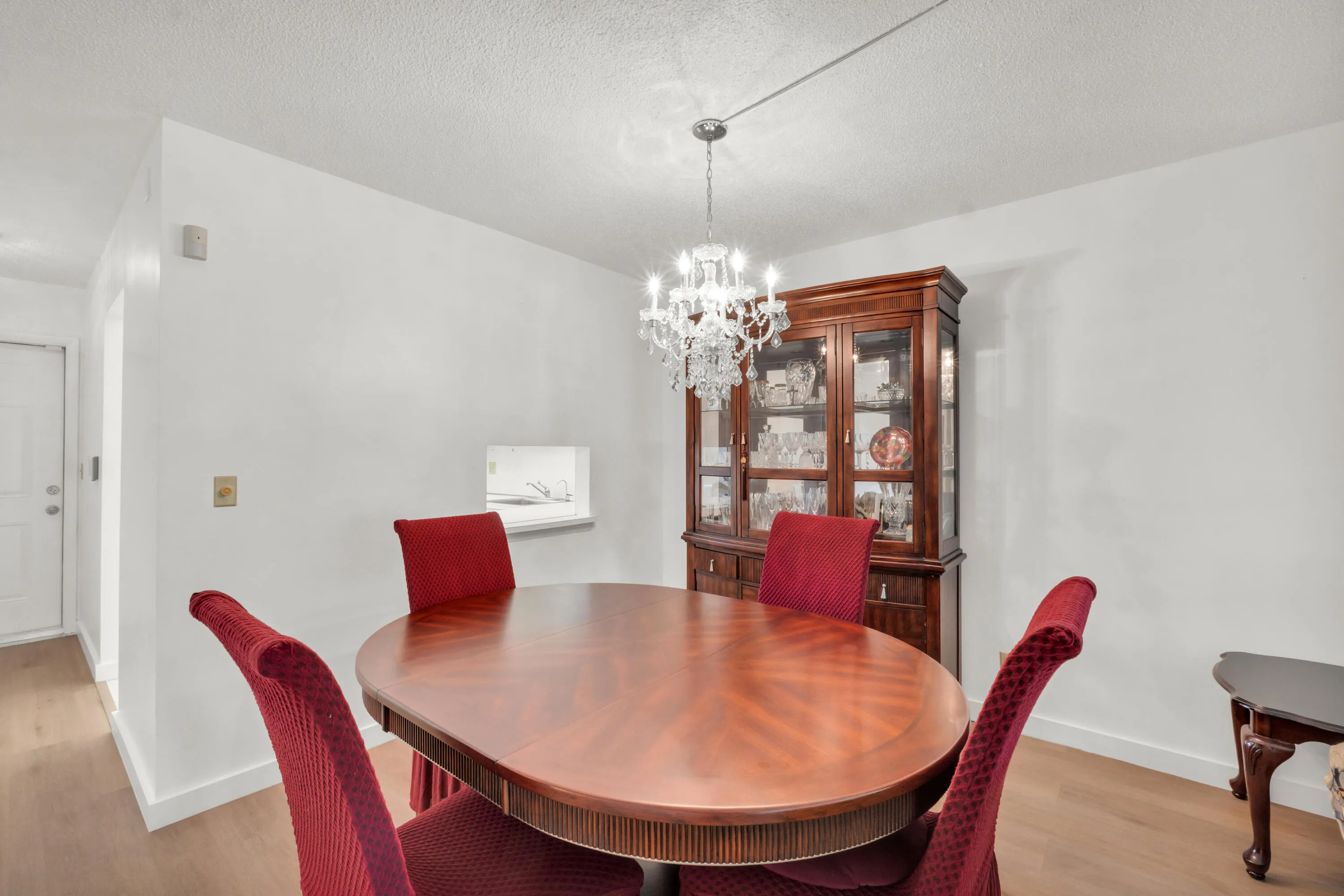Dining area featuring a pass-through window from the kitchen.