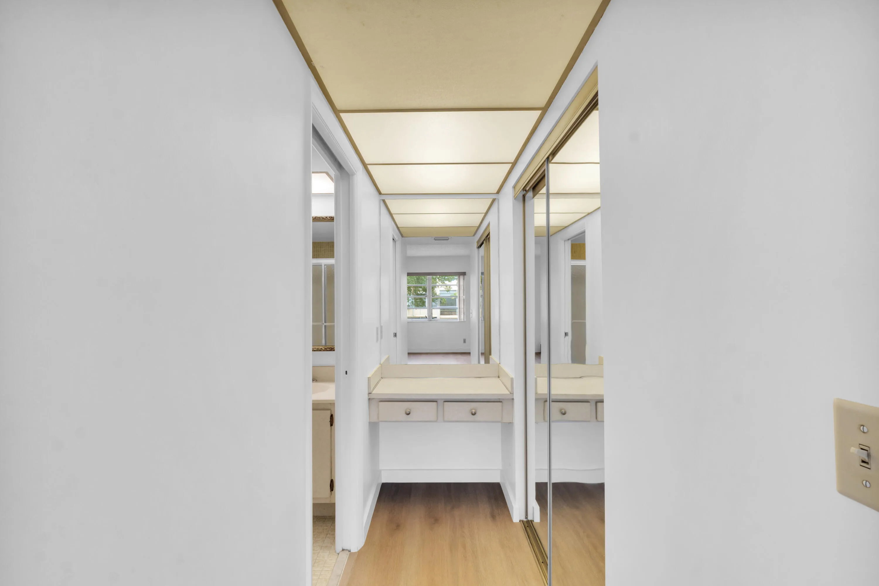 Primary bathroom features a convenient makeup vanity.