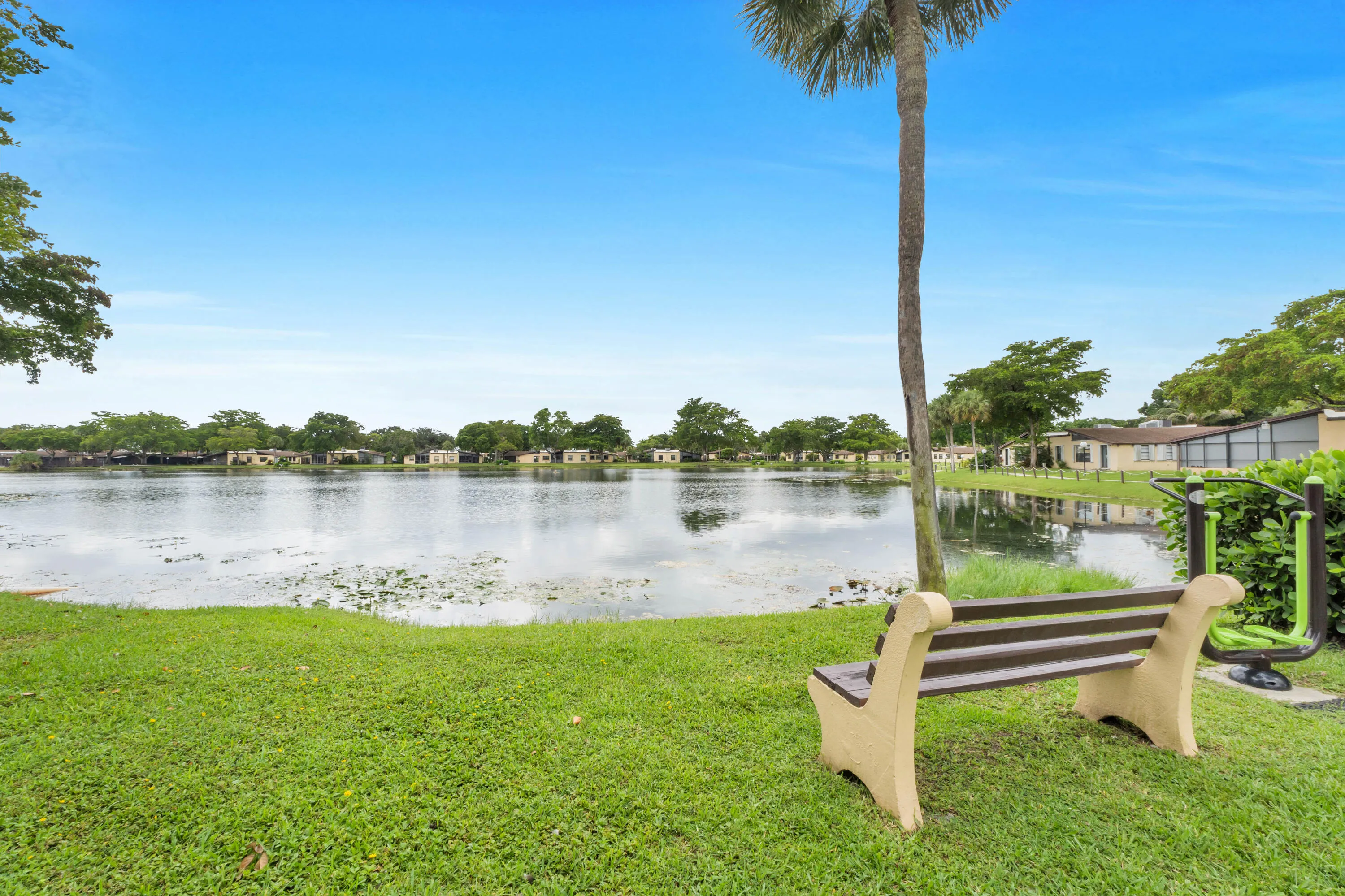The beautiful Carriage Hills lake features a surrounding walking path.
