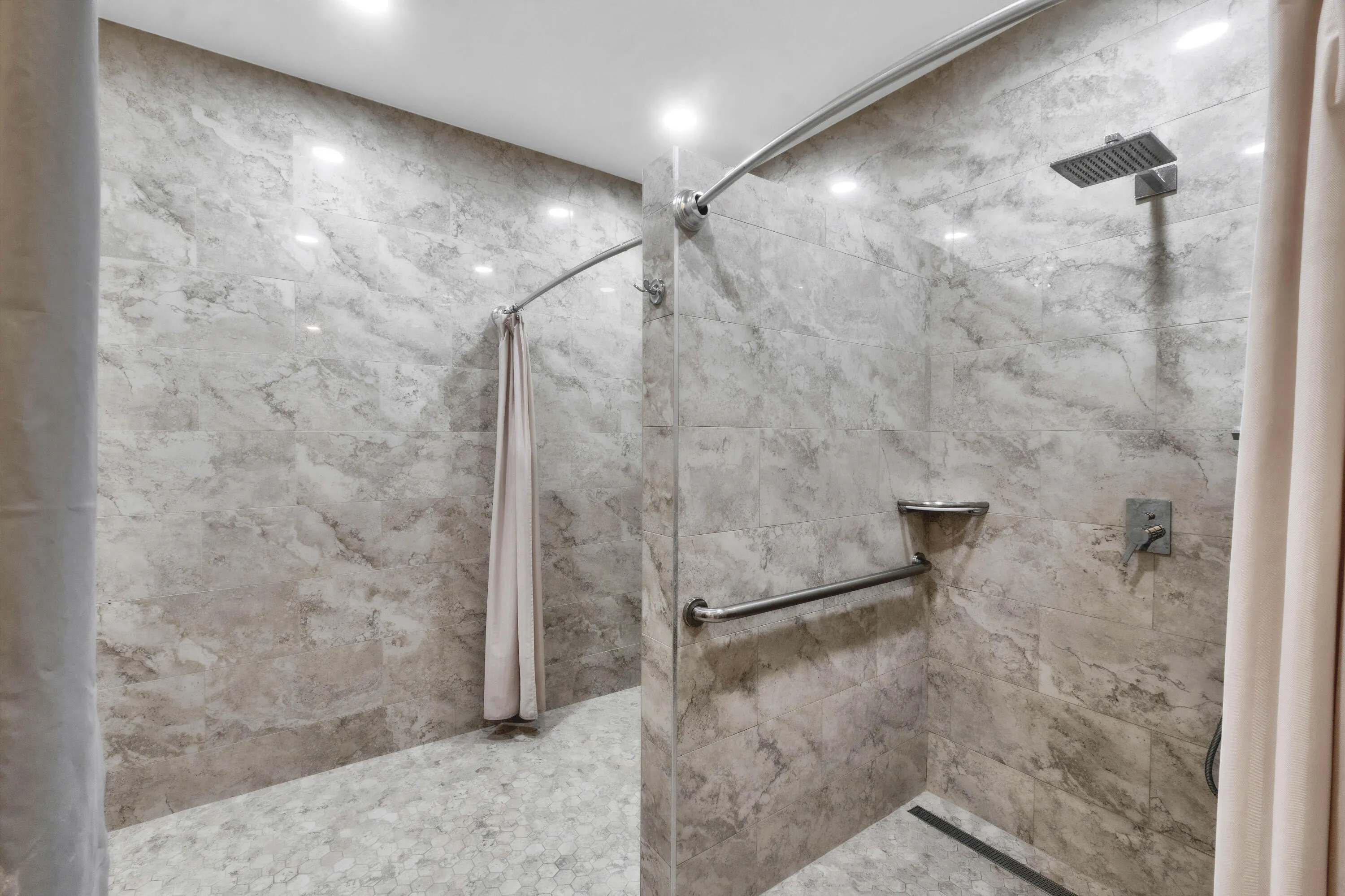 Newly-remodeled community bathroom showers.