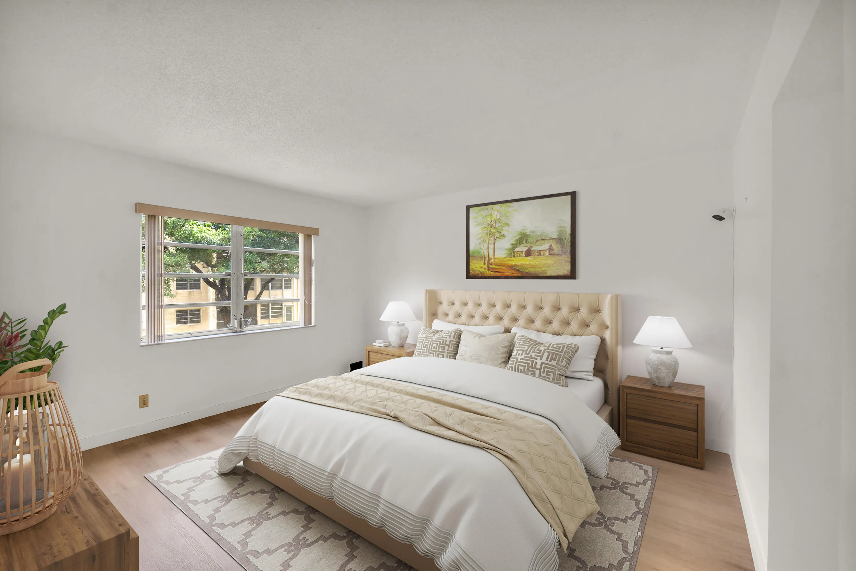 Spacious primary bedroom featuring luxury vinyl flooring (Virtually Staged).