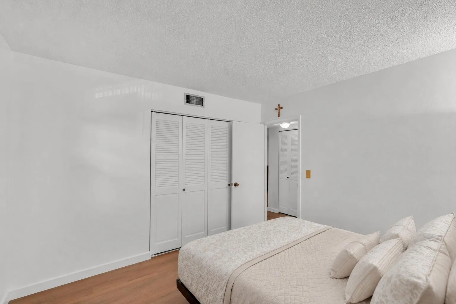 Guest bedroom featuring luxury vinyl floors.