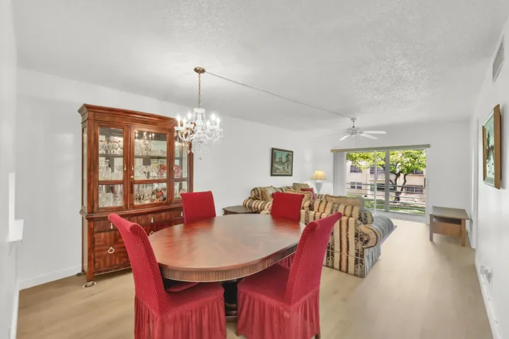 Open-concept living and dining area featuring luxury vinyl flooring.