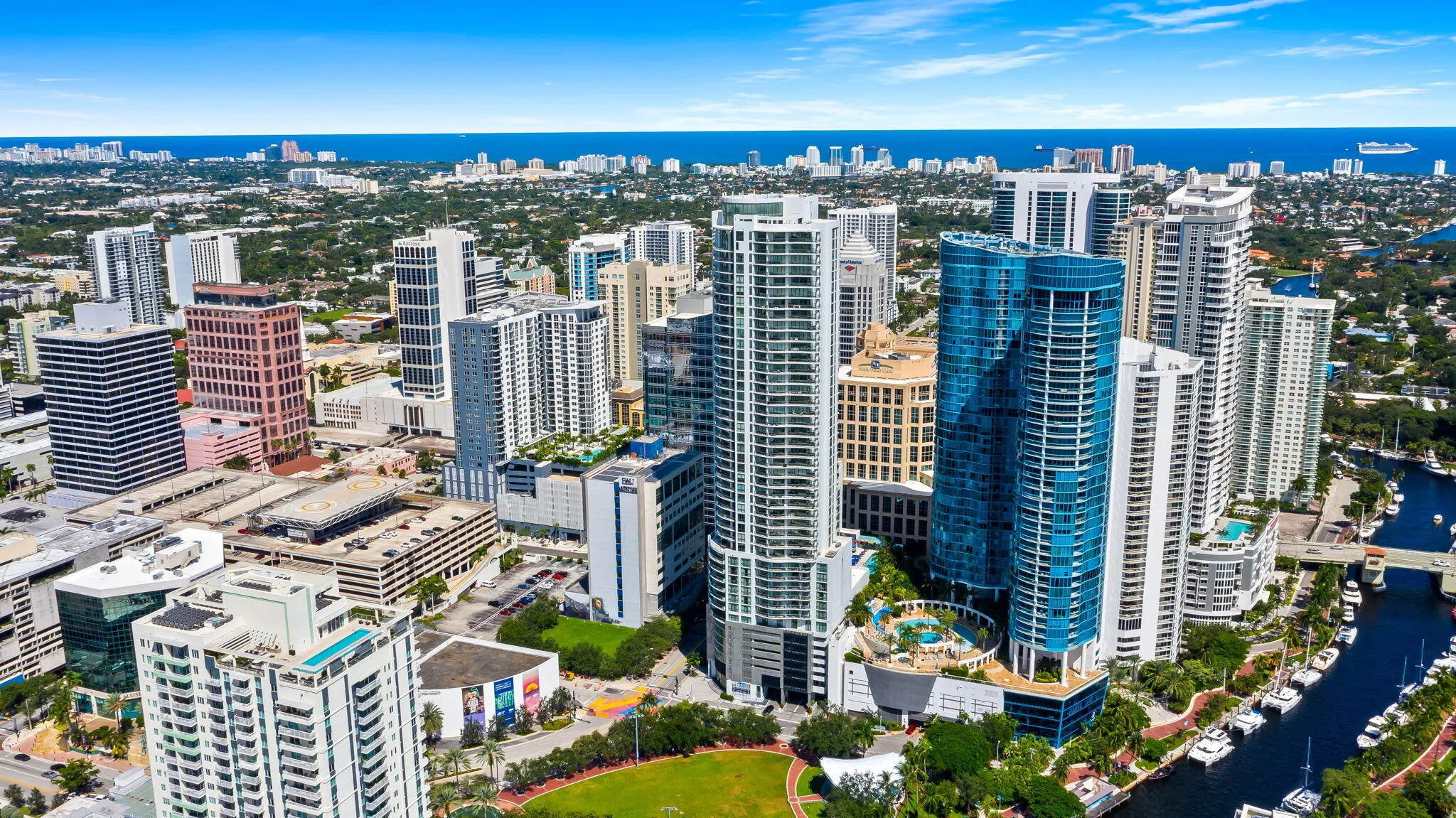 Aerial perspective highlighting high-rise architecture, proximity to waterways, and urban density