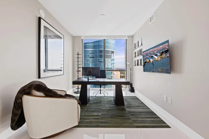 Expansive floor-to-ceiling window offering cityscape views