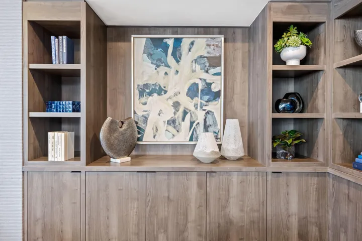 Built-in cabinetry featuring open shelving and integrated closed storage