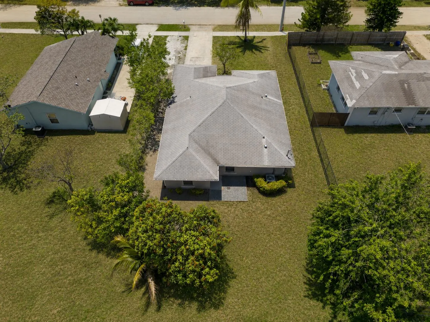 Aerial view highlighting the property’s spacious lot and surrounding green space