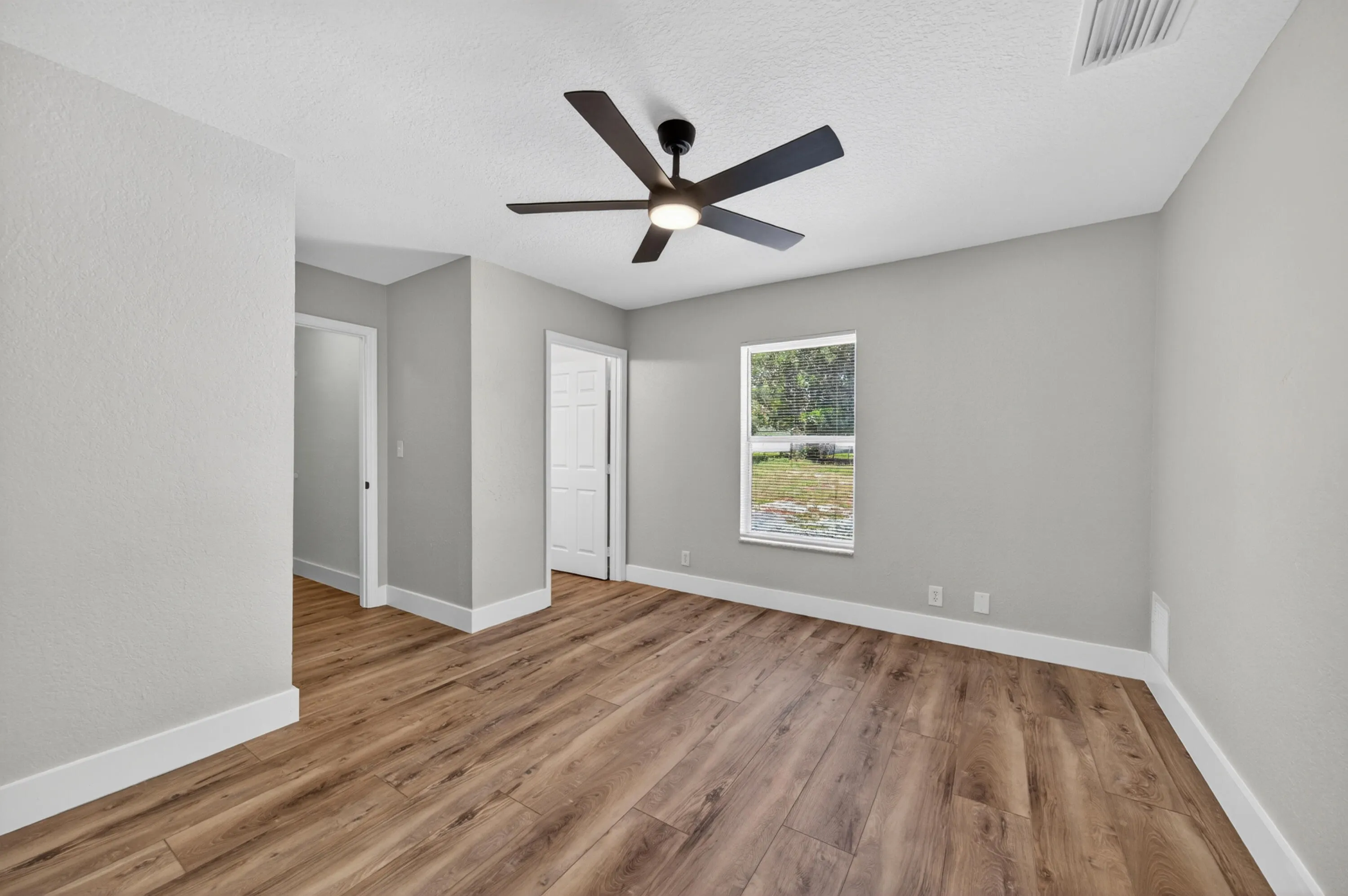 Primary suite with modern finishes and easy access to the main living areas