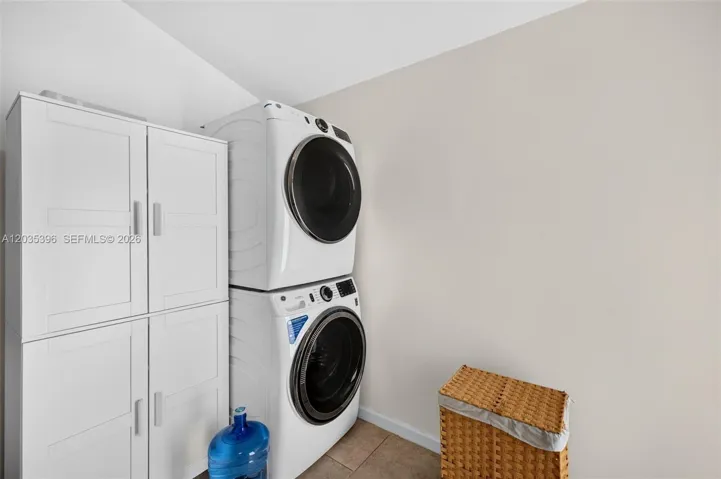 Laundry Room w/ separate door to exterior in the main house. (2 sets of washer dryers, one in main house and one in guest house)