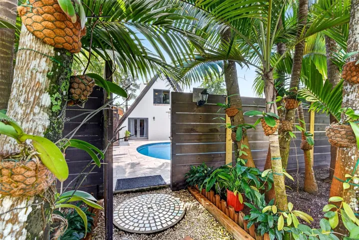 View from Guest house side to Main house / Pool area and gate / fence