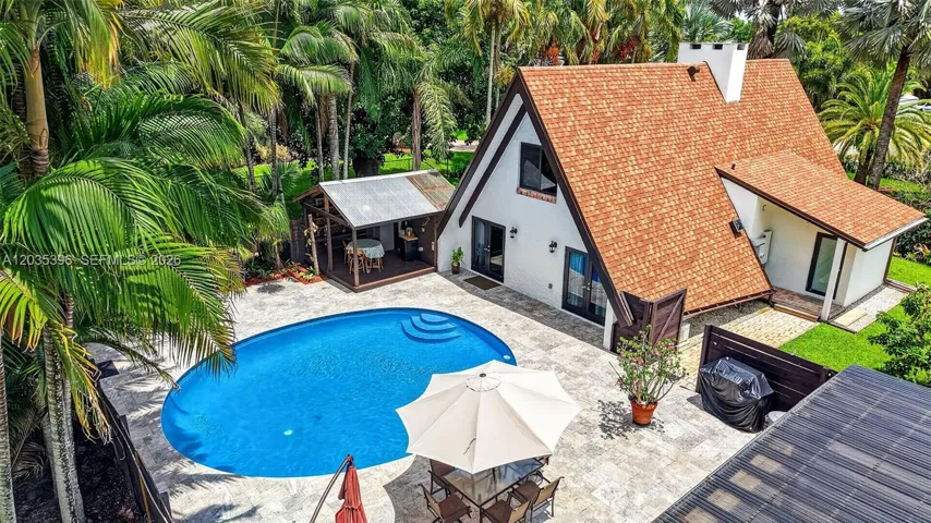 Aerial view of main house and large pool & pool bathroom