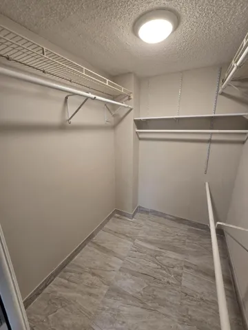 PRIMARY BEDROOM WALK-IN CLOSET
