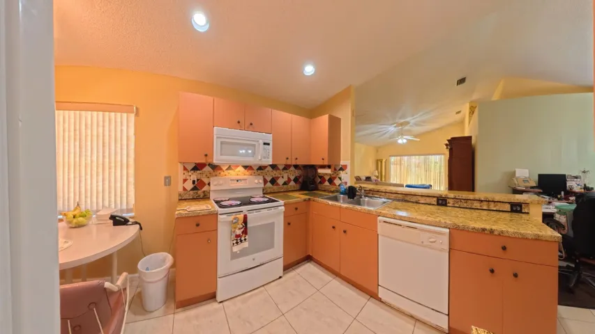Kitchen with view of living room