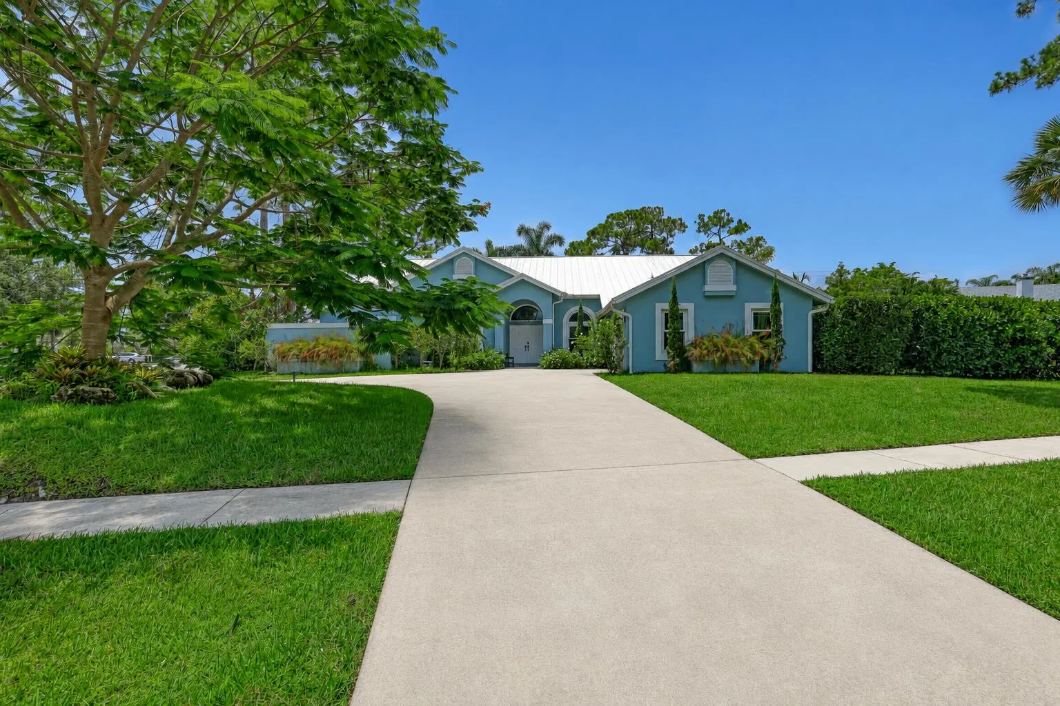 Circular concrete driveway and walkway leading to your front door