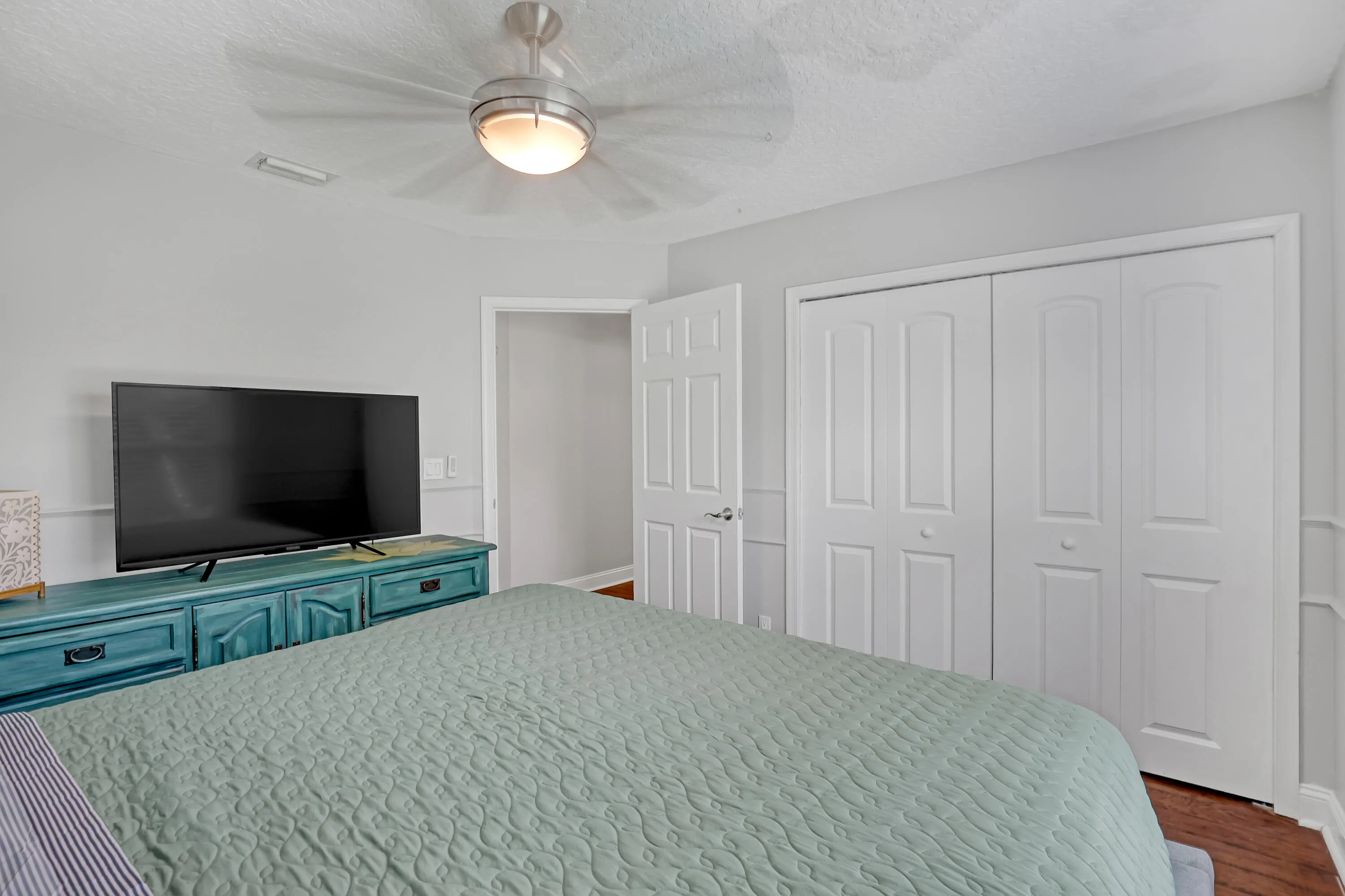 Recessed ceiling light with a brushed nickel ceiling fan