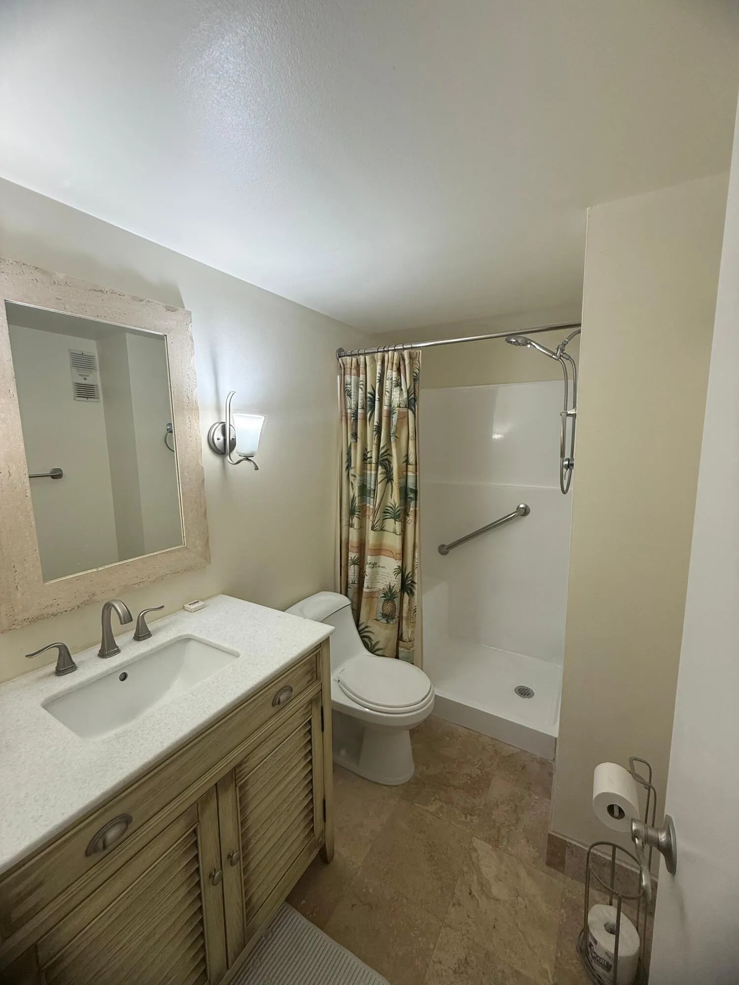 Bathroom featuring a single vanity with a white countertop, an undermount sink, and a rustic wood-finish cabinet