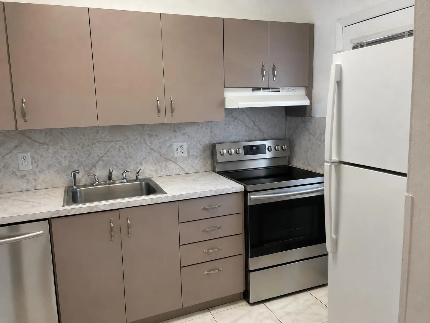 Appliances digitally edited - new stainless steel appliances may differ slightly.