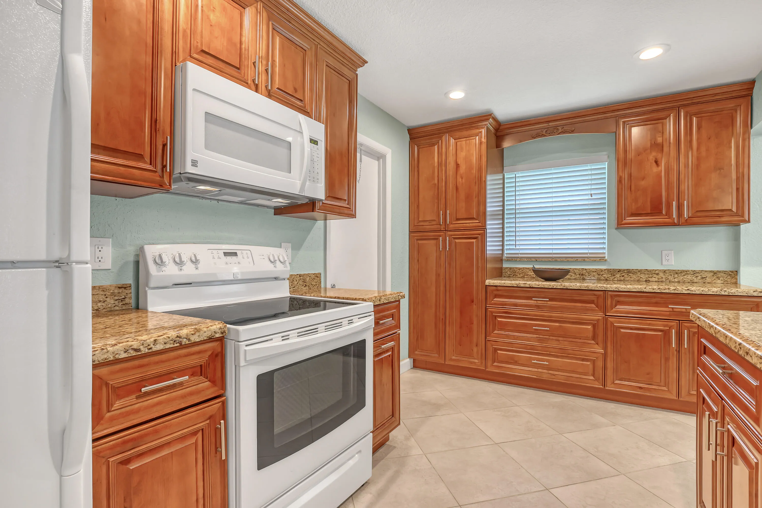 Kitchen cabinetry all replaced with granite countertops, recessed lighting. newer appliances. Extra cabinetry plus pantry added.