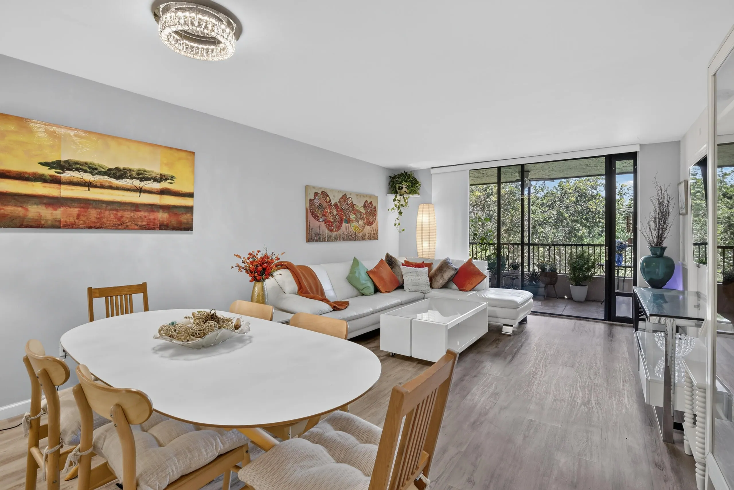 Open-concept living area with wood-finish flooring