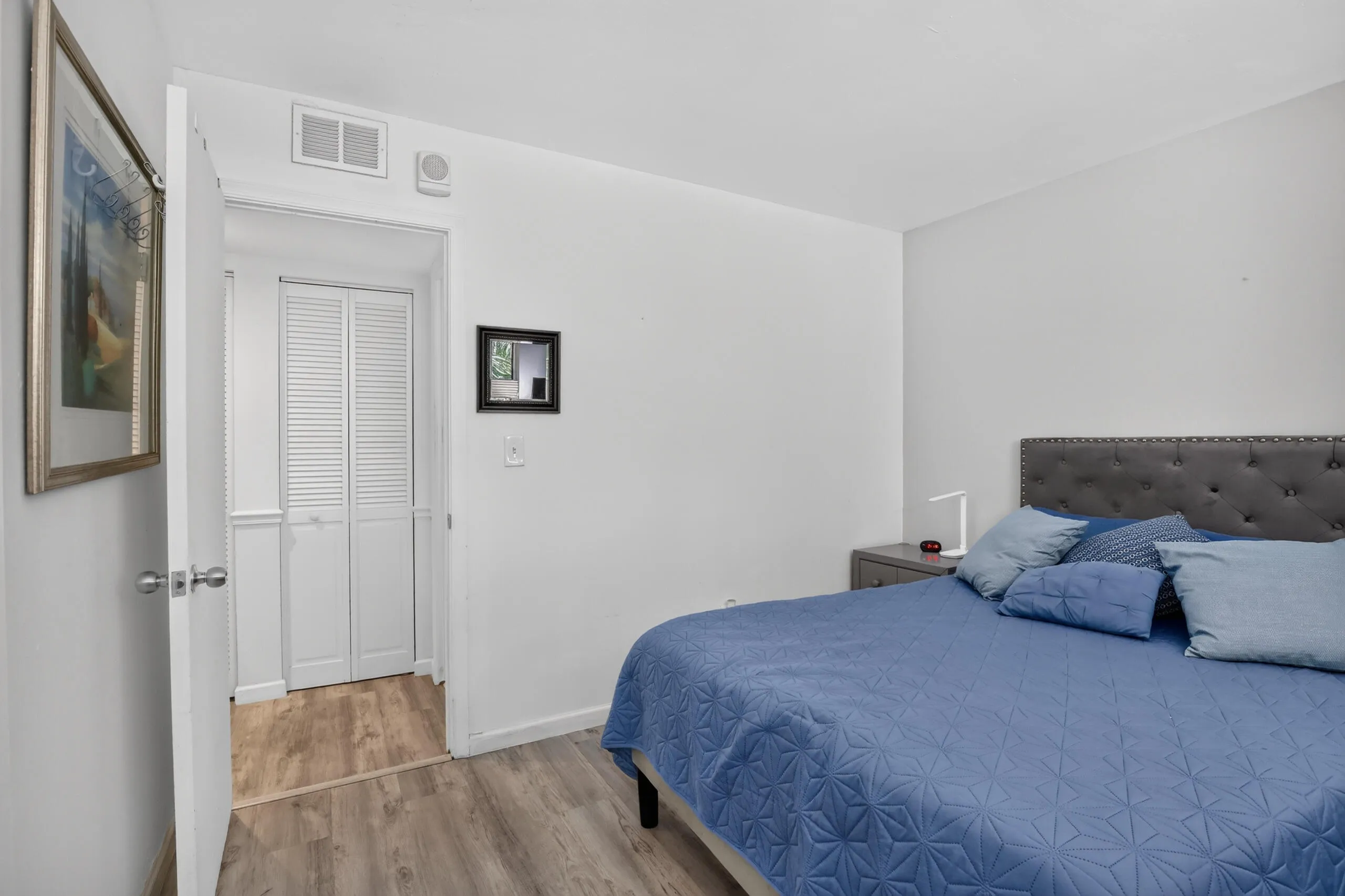 Bedroom featuring light wood-finish flooring and white walls