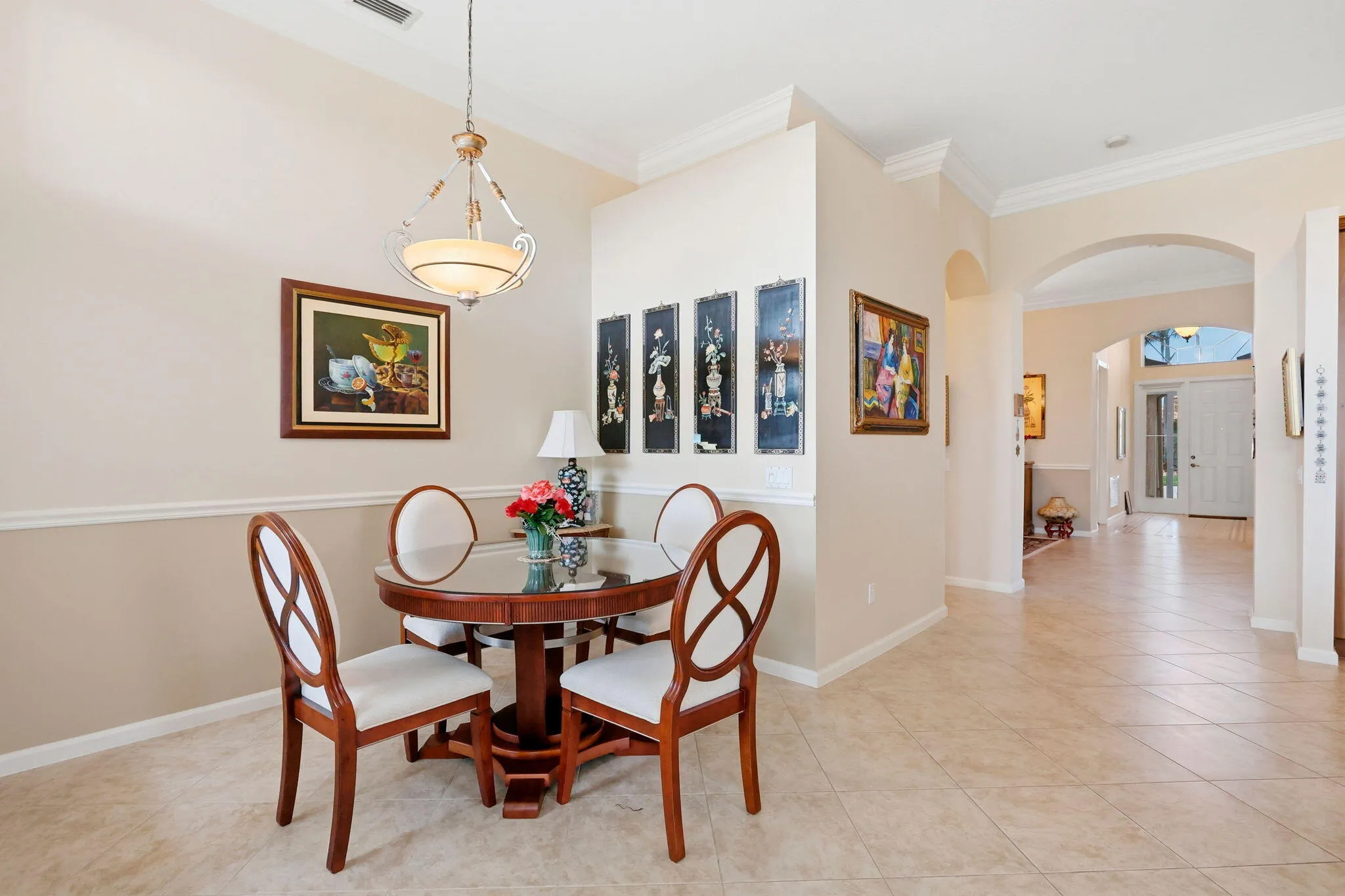 Dining area featuring crown molding and chair rail detailing