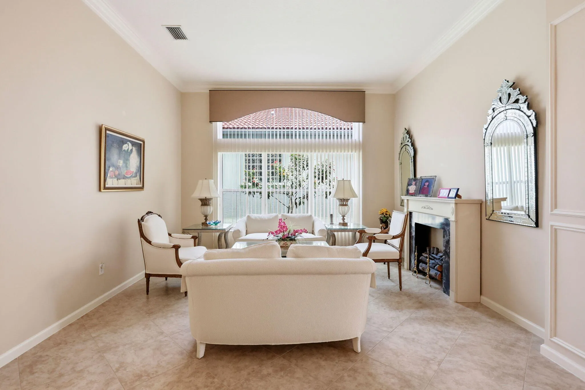 Spacious room featuring neutral wall tones and tile flooring