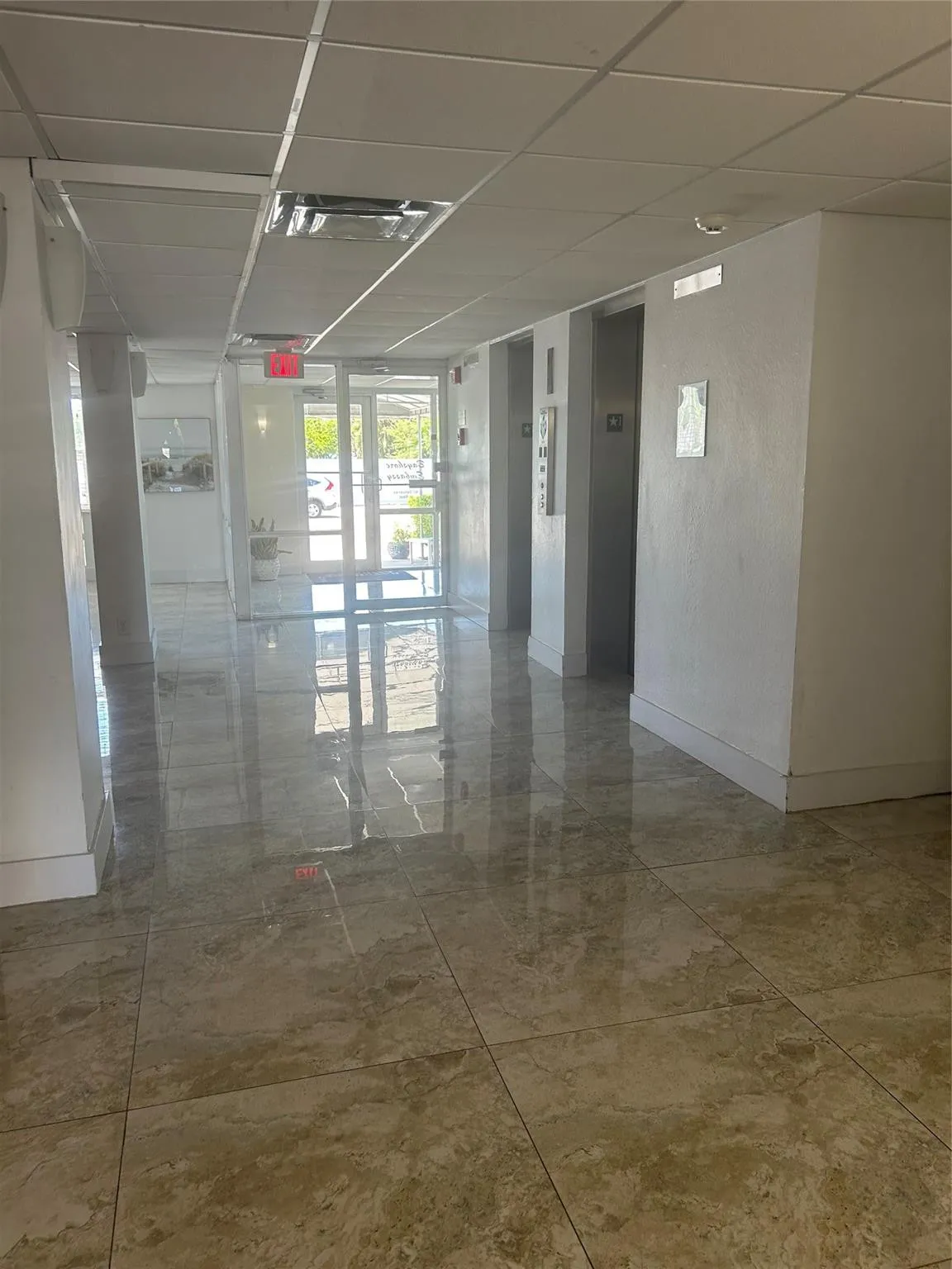 Impact glass doors, marble flooring, two elevators, security enterence, intercom system, face recognition option