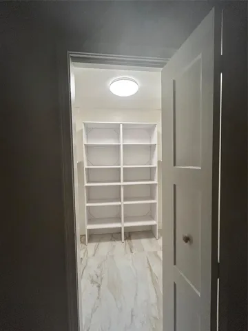 Bifold door opens from right to left to walk in closet