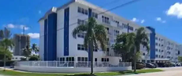 corner location building has five floors, fenced pool patio area, grass n trees, canopy entry,assigned parking in front and rear with guest spaces