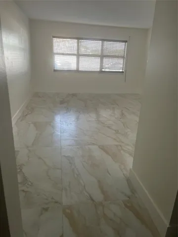 Livingroom dining area has: ceramic tile flooring, windows face west, Exterior hurricane shutters roll down over impact hurricane windows, new wood horizontal blinds, Fiber optic fast internet n modeum included.