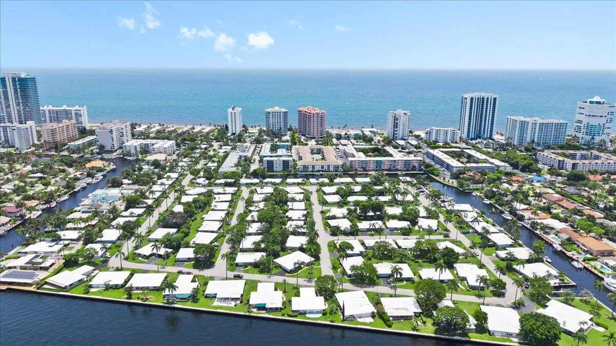 Aerial perspective showcasing a coastal community with multiple waterways