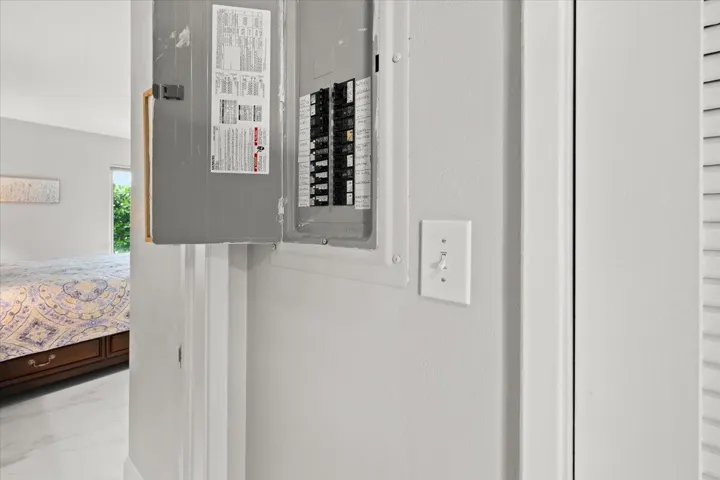 Electrical panel with a white light switch and white trim detailing
