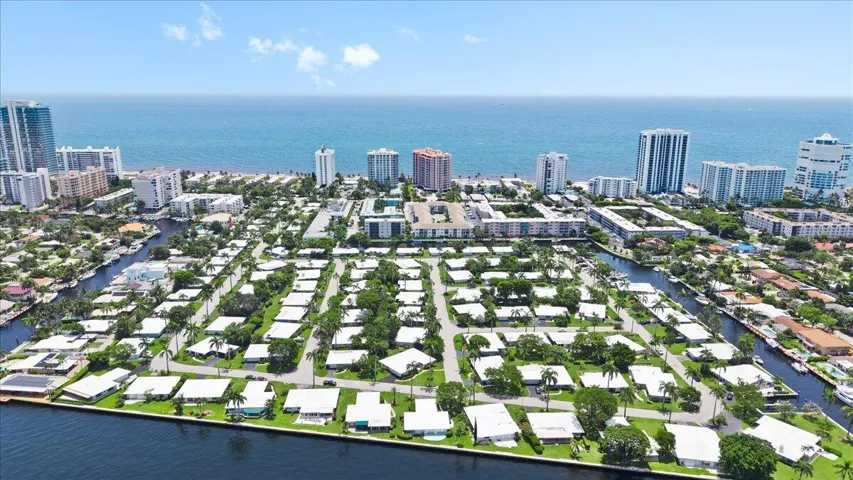 Aerial perspective showcasing a coastal community with multiple waterways