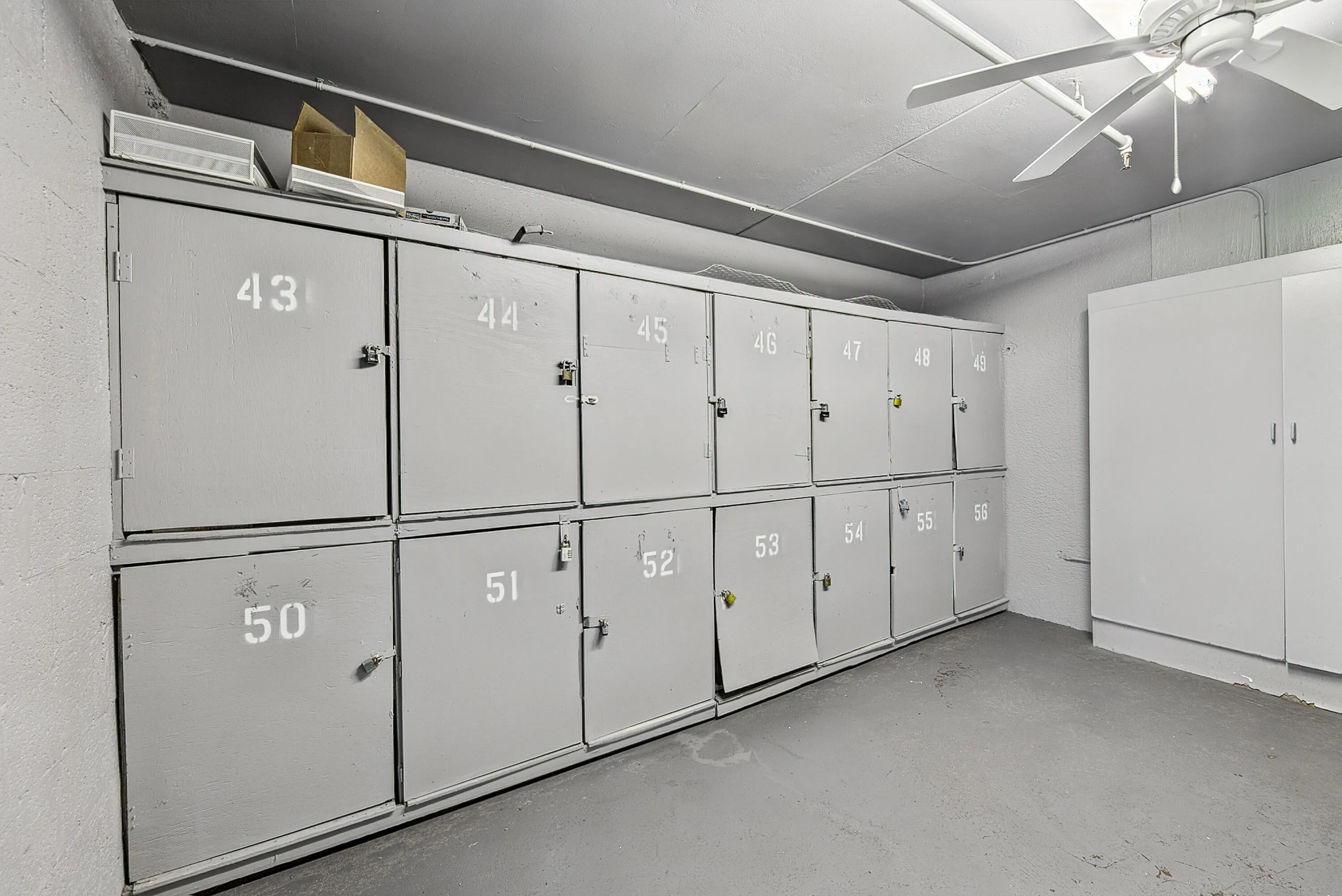 Storage unit area with multiple individual lockers featuring numerical labels