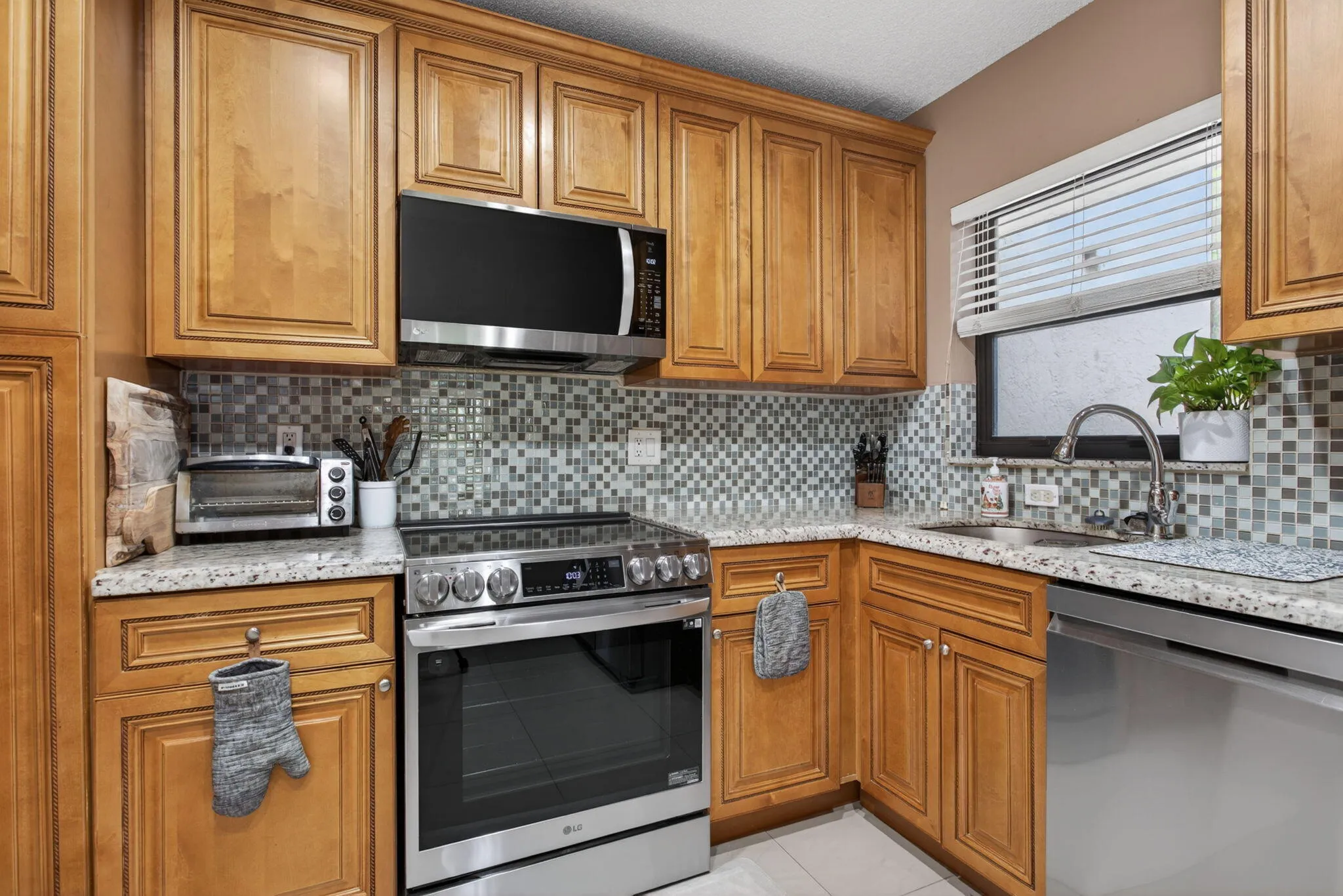 The kitchen is tastefully updated with new stainless steal appliances and custom cabinets.