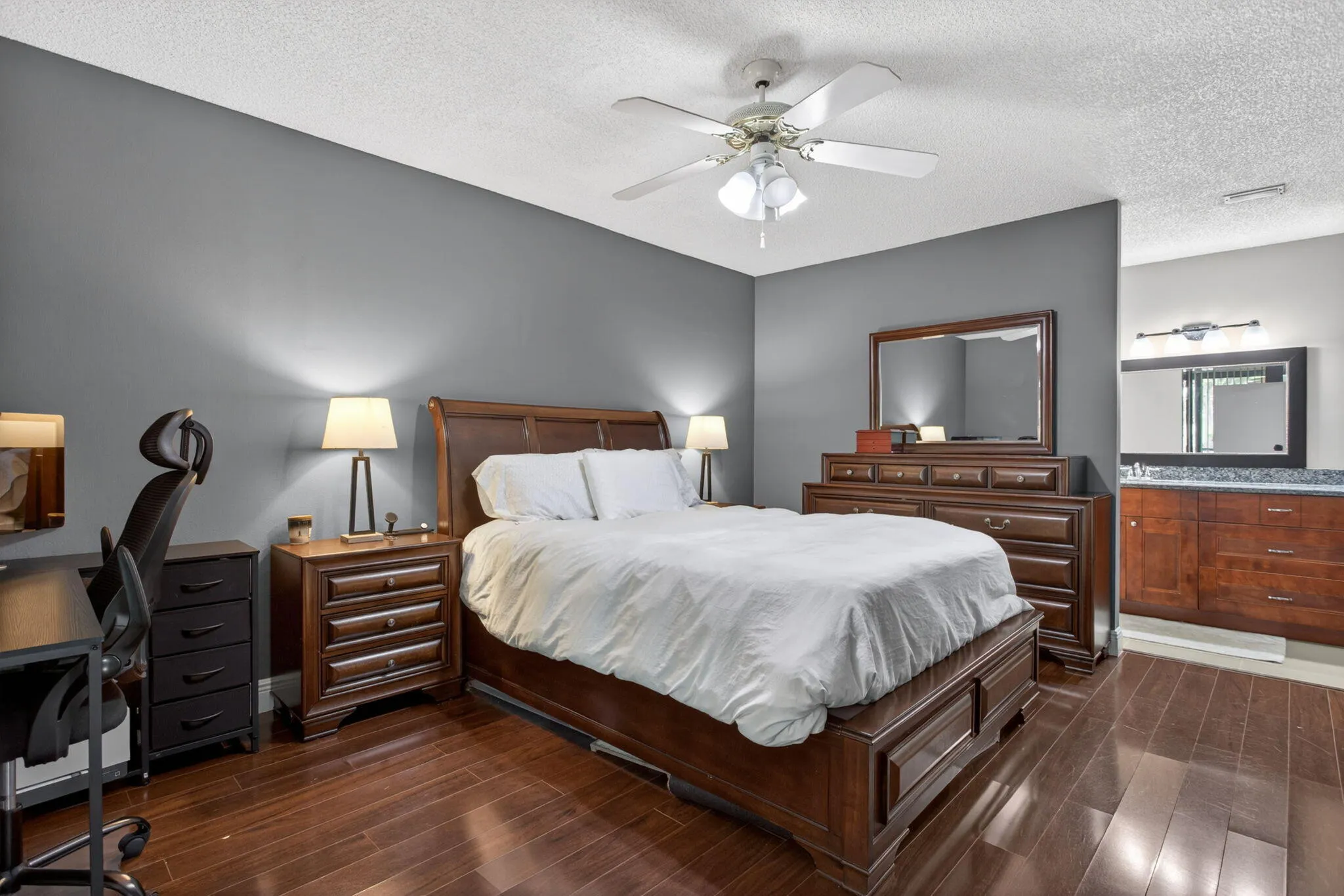 The home has a big primary bedroom with a large walk-in closet, and an ensuite bathroom.