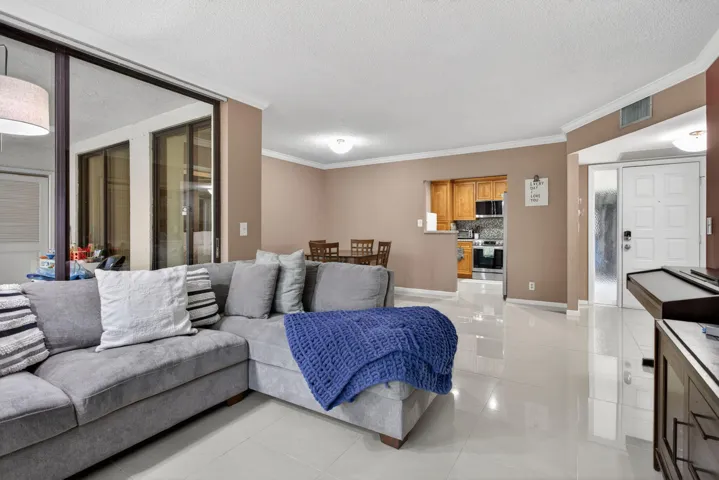 The unit has a lot of natural light from the floor to ceiling impacted windows. The unit has beautiful porcelain tile that runs throughout the living, dining and kitchen.