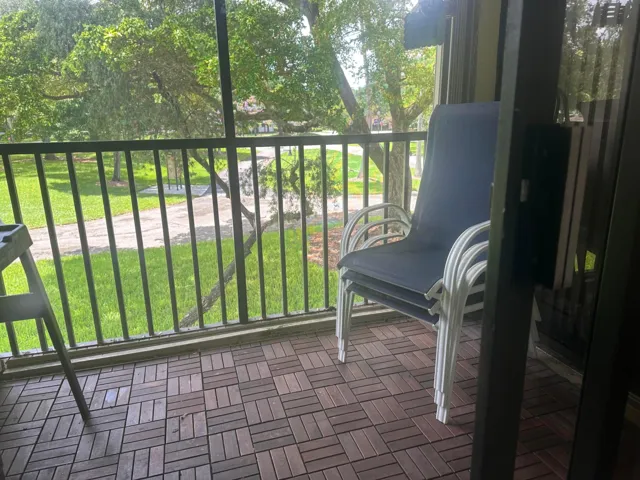 Screened Balcony with Garden View