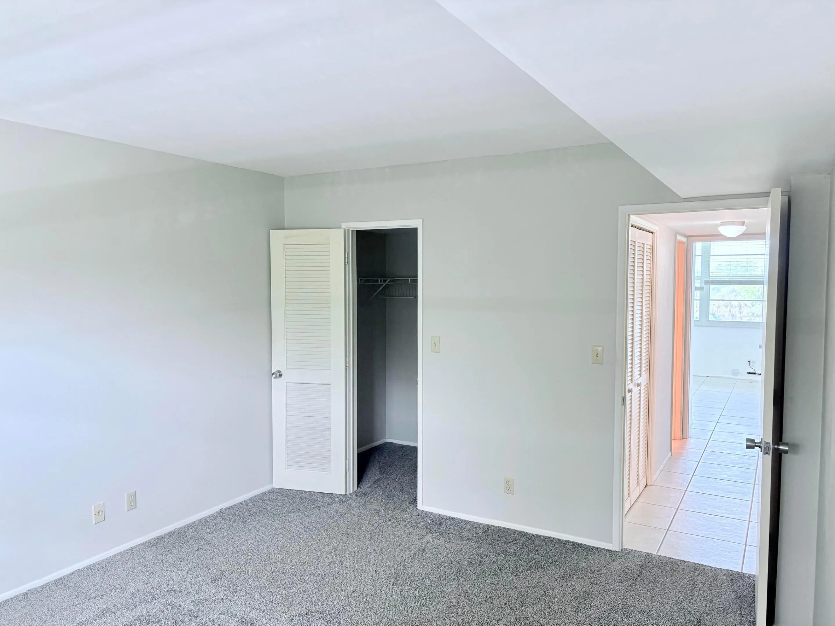 2nd bedroom with a walk in closet.