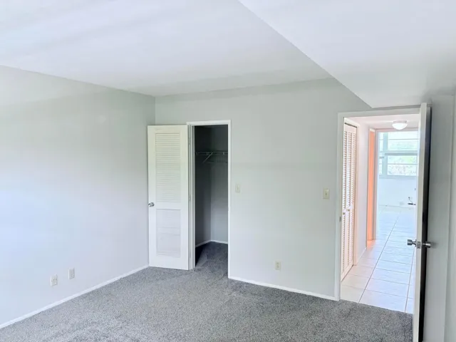 2nd bedroom with a walk in closet.