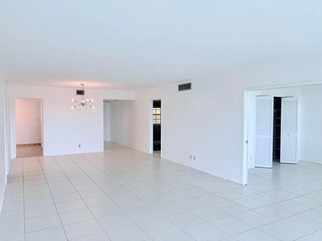 Living area. 3rd bedroom to the right with pocket doors.