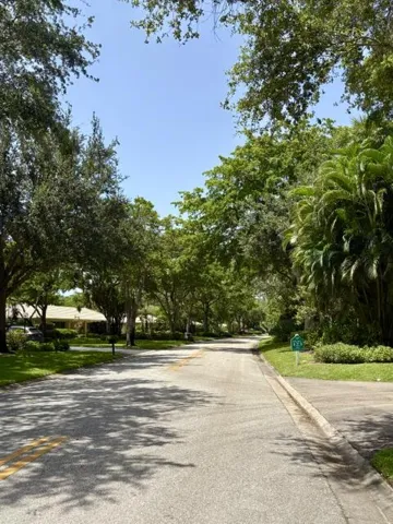 Cypress Grove Lane with mature trees, traffic exclusive to the residents.